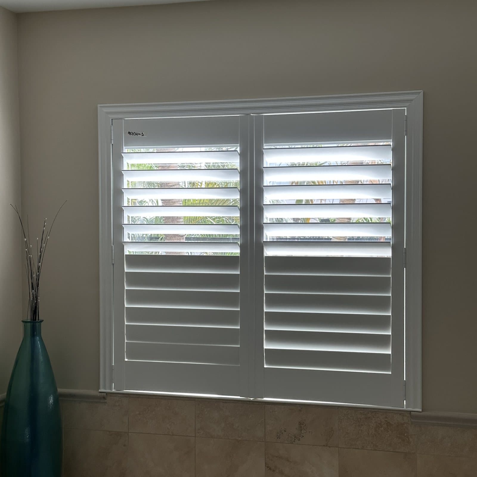 Plantation shutters installed in a South Florida bedroom