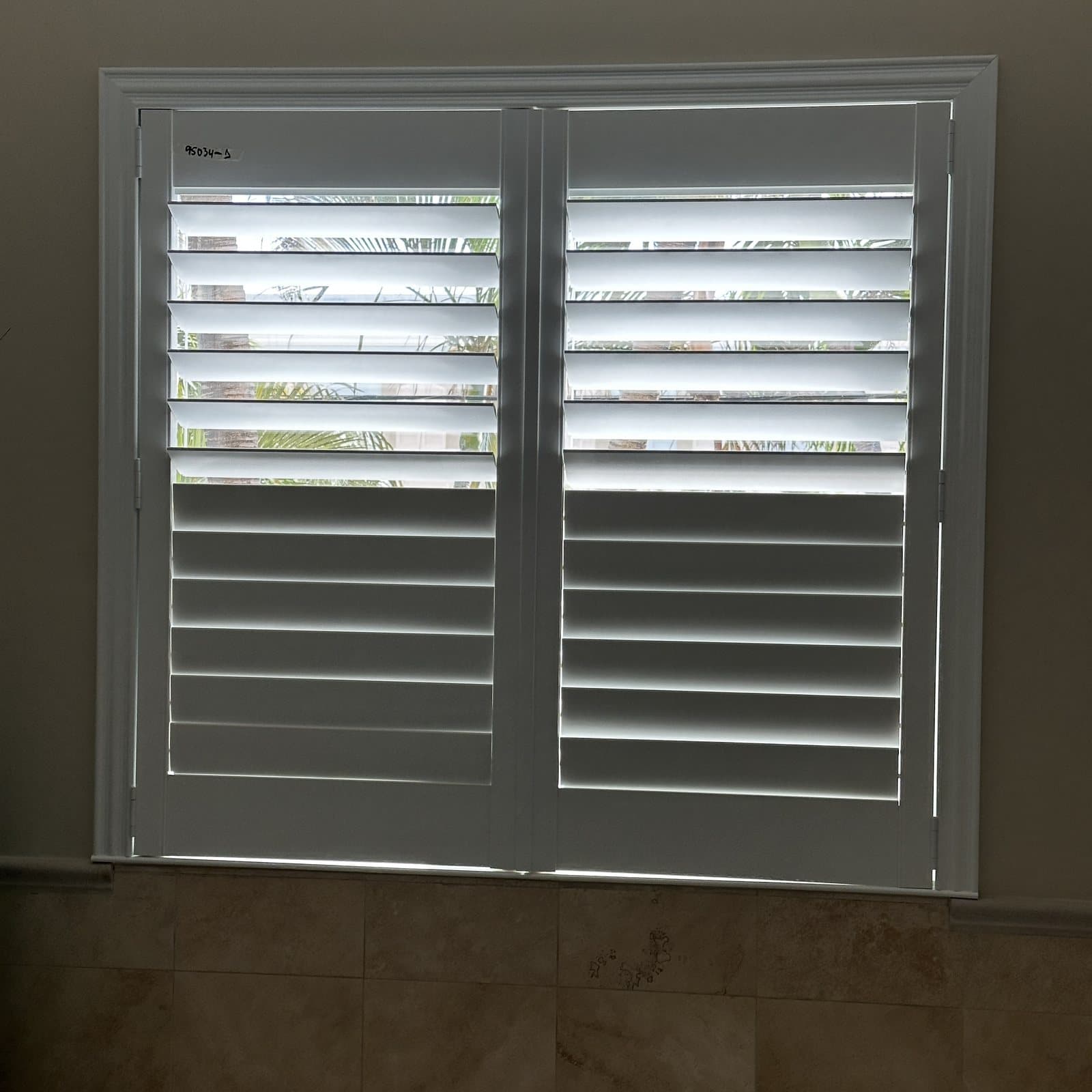 Plantation shutters installed in a South Florida bedroom