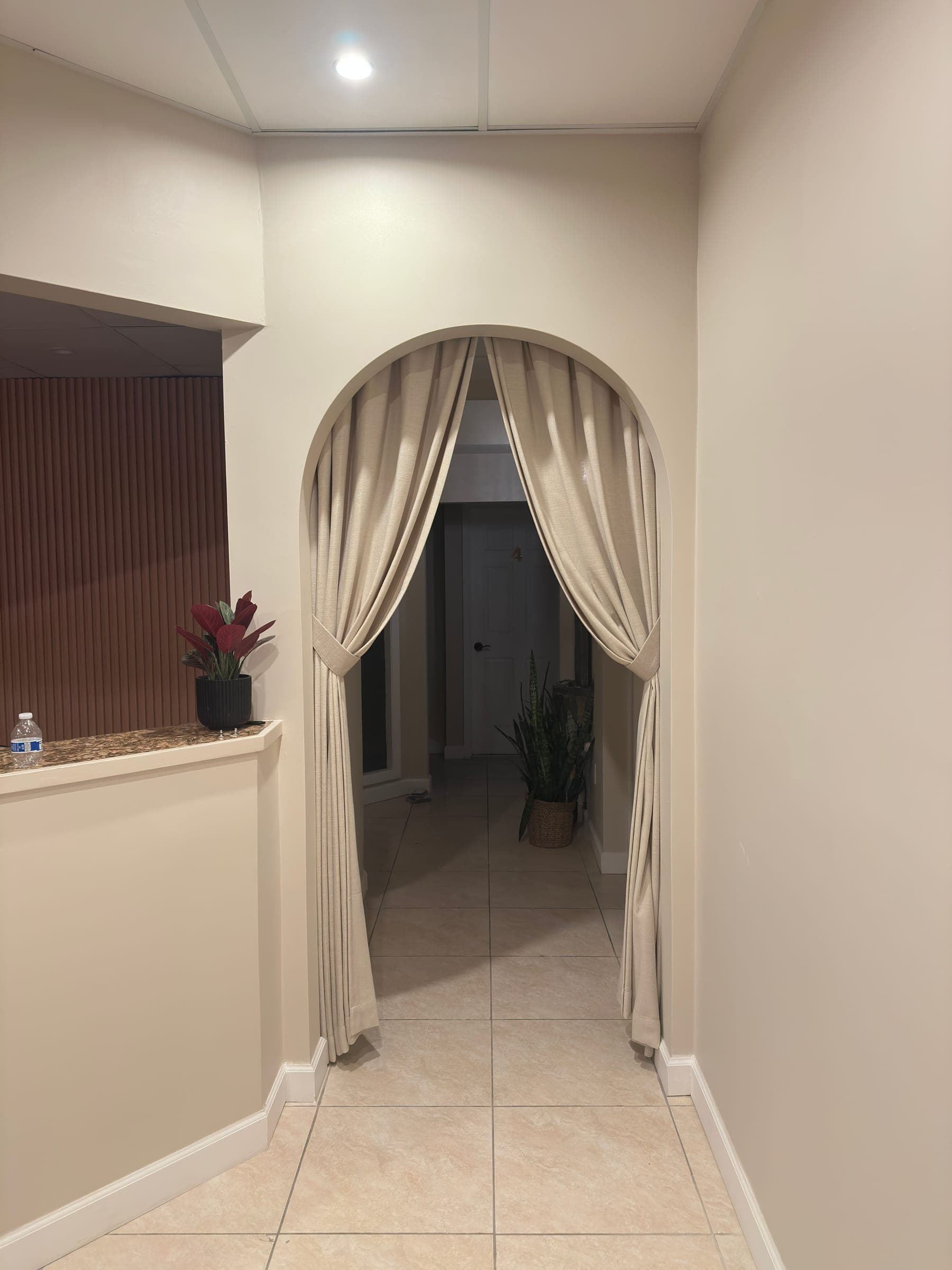 Commercial arched drapery detail in a Coral Springs interior entry